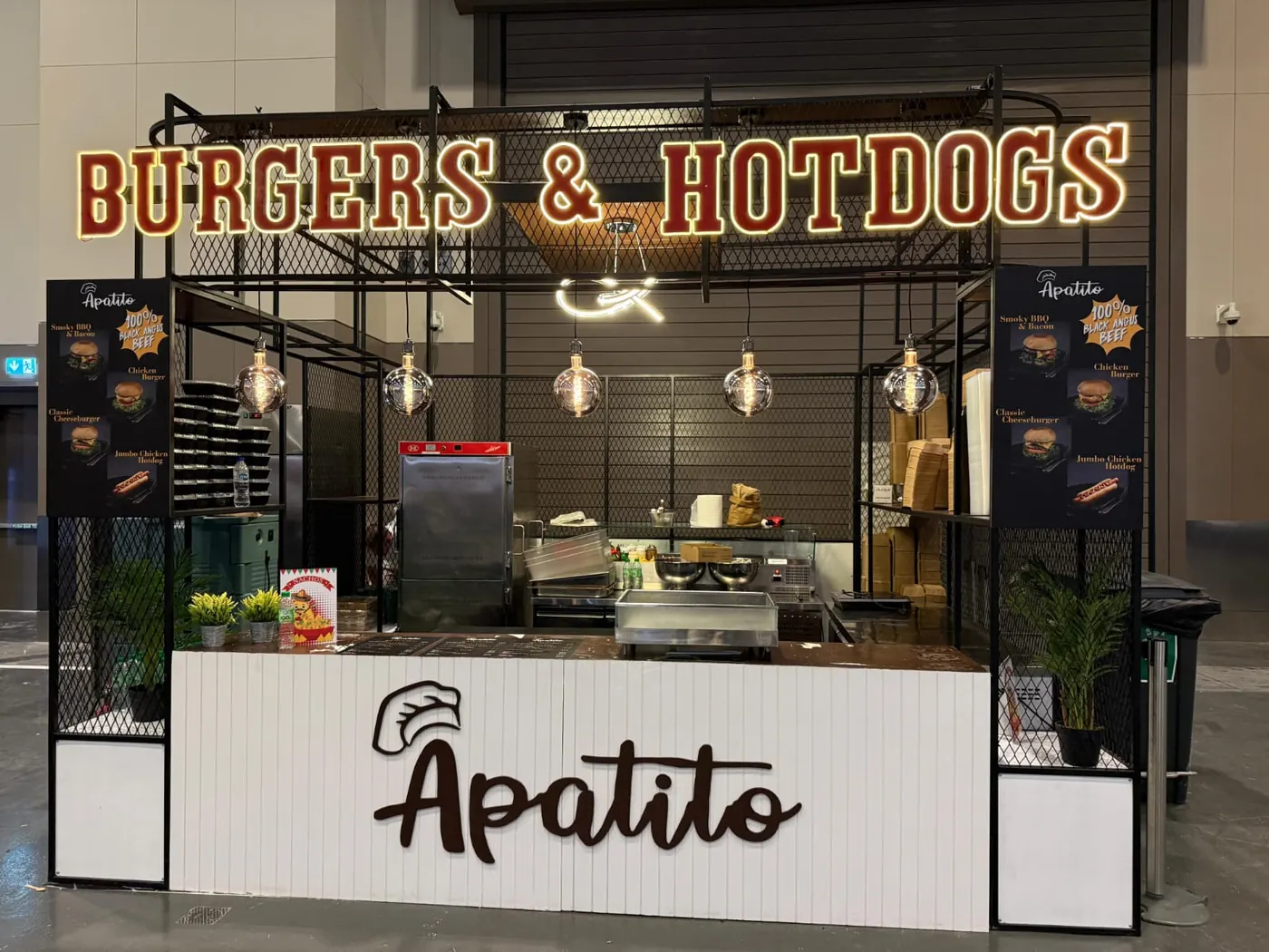 Food kiosk with mesh frame and lit signage