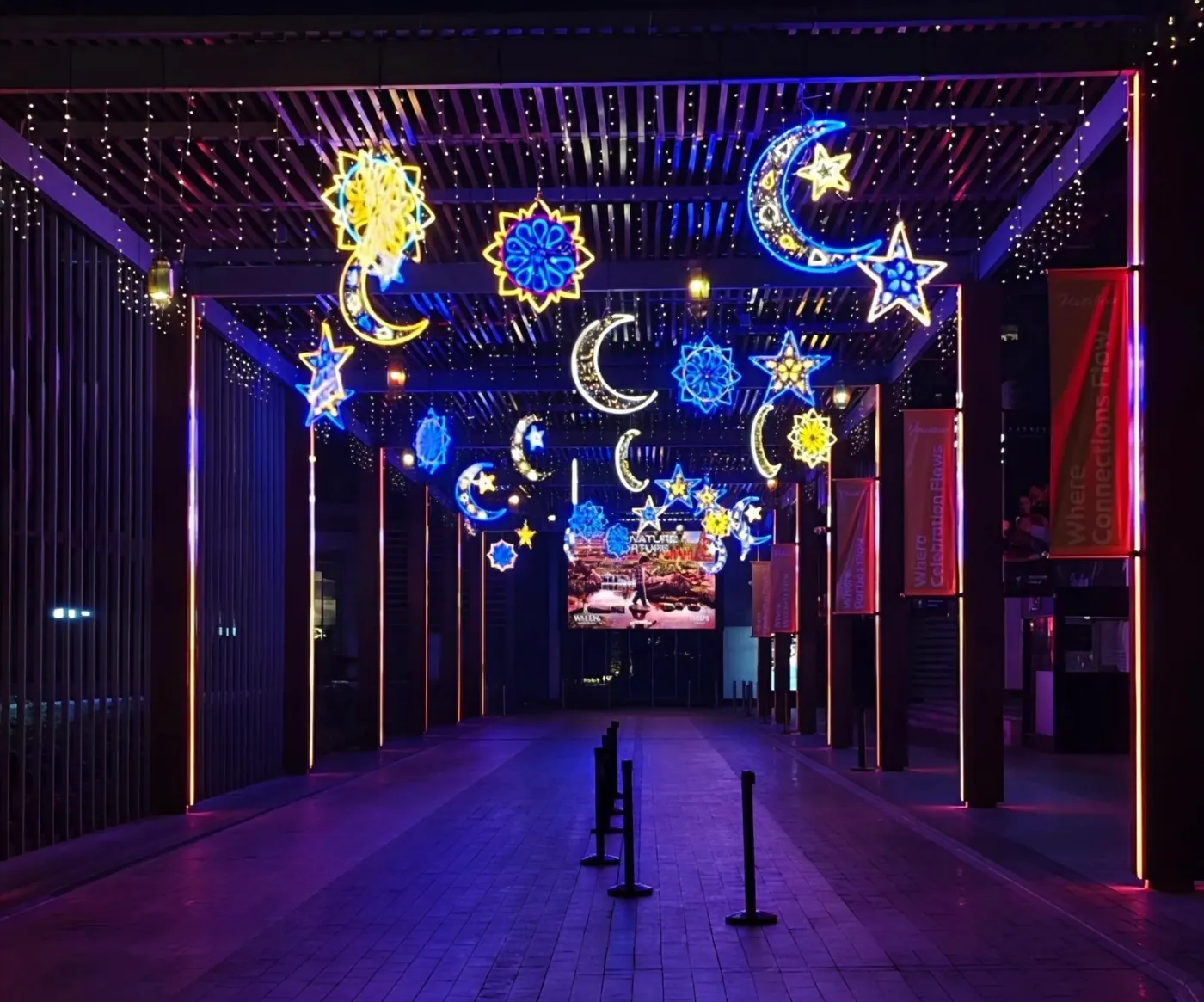 Hanging neon moons and stars for a walkway