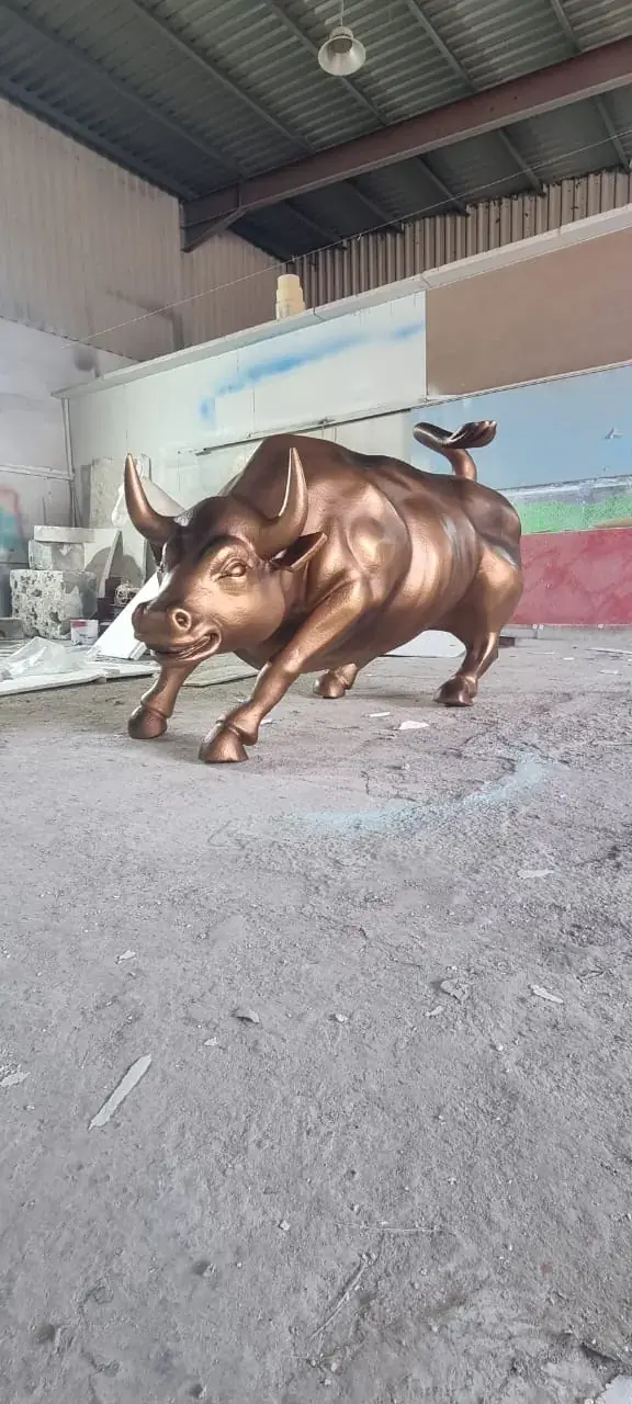 Bronze-finish bull sculpture