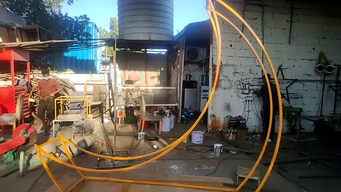 Large crescent frame being welded in our workshop