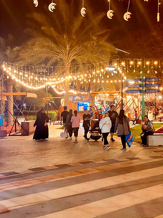 Festival promenade with string lights and crescent decor