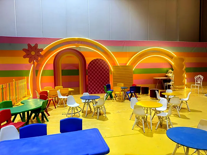 Rainbow themed kids zone with arches