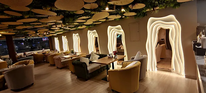 Seating booths with lit arch frames