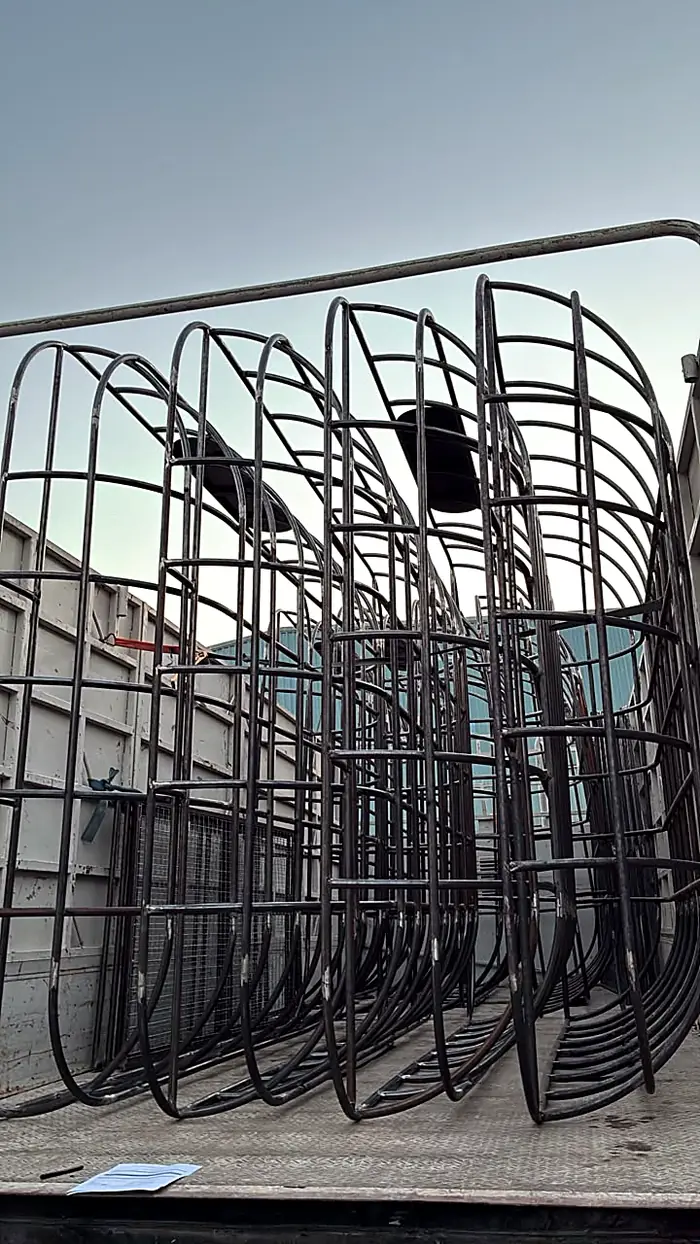 Curved tube frames loaded for delivery