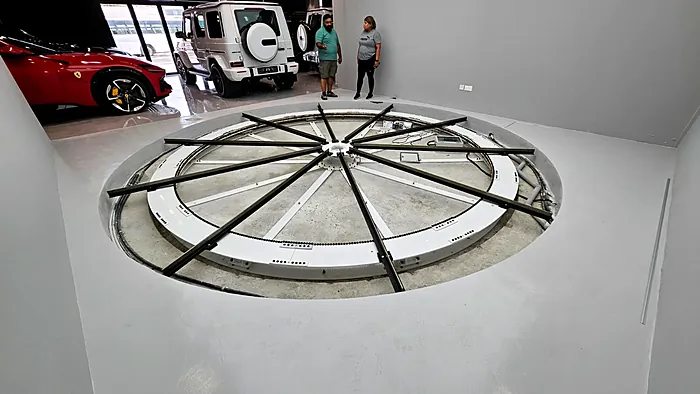 Car turntable being installed in a showroom