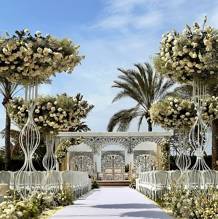Wedding aisle with floral arches and stage