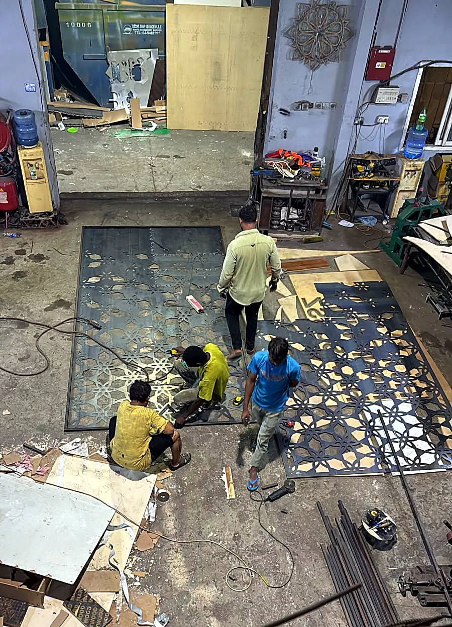 Laser-cut pattern panels being assembled